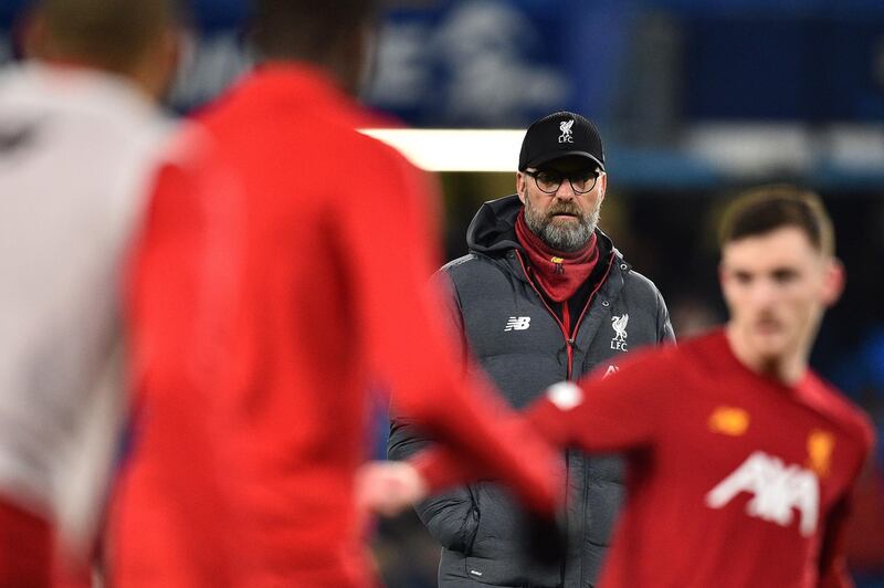 Liverpool's German manager Jurgen Klopp watches his players warm up. AFP