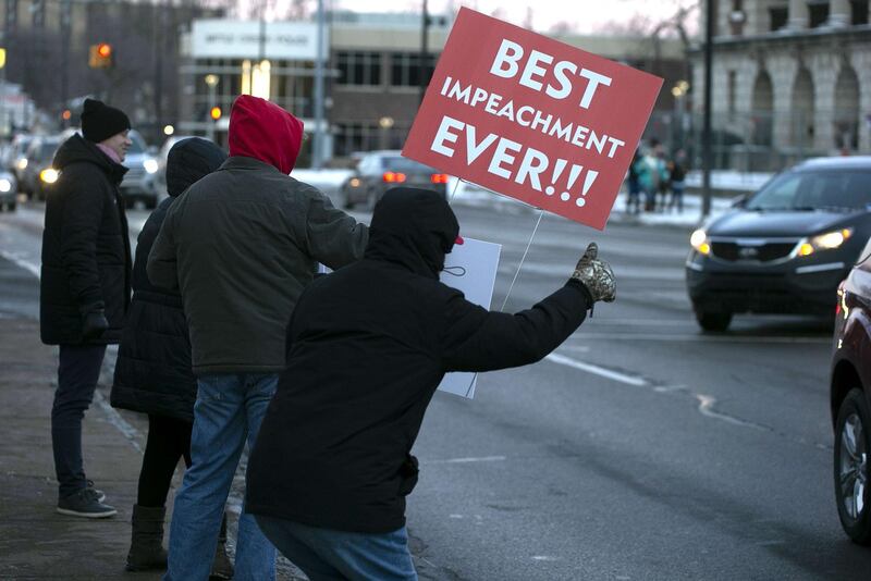 Anti-Trump protesters gather in Monument Park on December 18, 2019 in Battle Creek, Michigan.   Getty Images/AFP