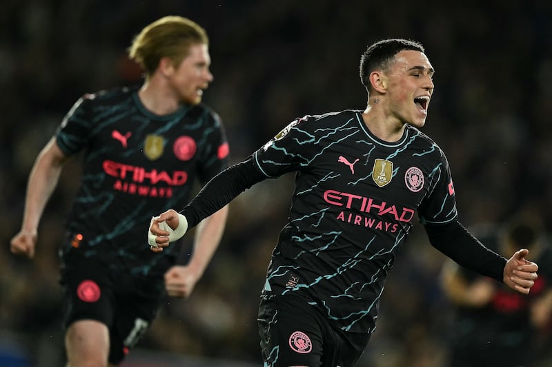 Manchester City's Phil Foden celebrates scoring his team's second goal. AFP