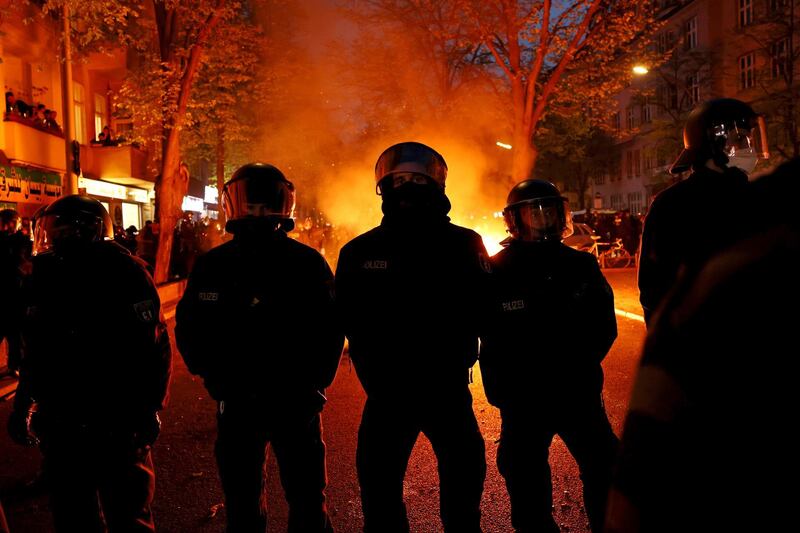 Police stand in front of a fire during the annual leftist protest march on May Day amid the third wave of the coronavirus pandemic on Saturday in Berlin, Germany. Getty Images