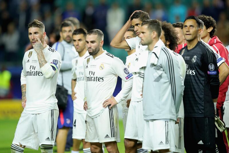 Sergio Ramos, left, of Real reacts with his teammates. Getty