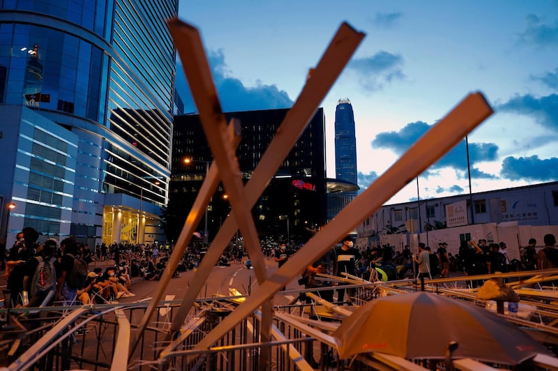 Protesters set up barriers outside the Legislative Council. AP Photo