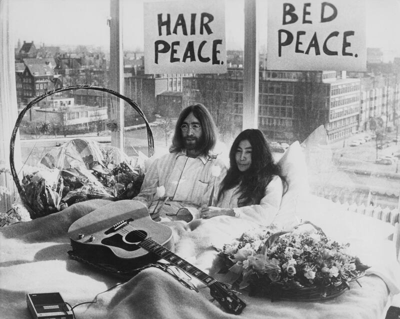 Beatle John Lennon (1940 Ôø? 1980) and his wife of a week Yoko Ono in their bed in the Presidential Suite of the Hilton Hotel, Amsterdam, 25th March 1969. The couple are staging a 'bed-in for peace' and intend to stay in bed for seven days 'as a protest against war and violence in the world'. (Photo by Keystone/Hulton Archive/Getty Images) 