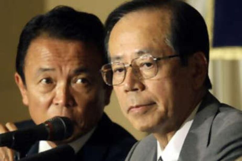 The former foreign minister Taro Aso, left, with the outgoing prime minister Yasuo Fukuda.
