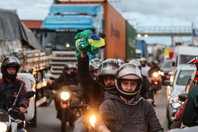 Supporters of President Jair Bolsonaro, mainly truck drivers, block the BR-101 highway in Palhoca, Brazil. AFP