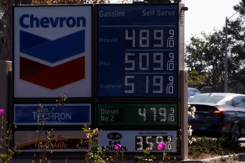 Petrol prices grow along with inflation as this sign at a gas station shows in Carlsbad, California. Reuters