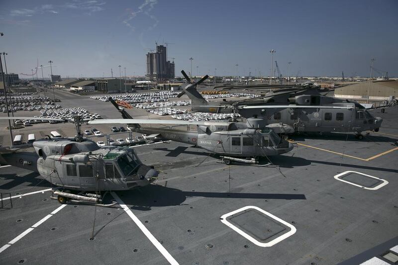 Helicopters on display at the deck of Cavour. The ship was designed to combine fixed wing vertical and/or short take-off and landing (V/STOL) aircraft and helicopter air operations. Silvia Razgova / The National