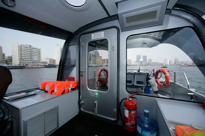 Dubai, United Arab Emirates, July 27 2011, Jonathan Gornall Story, RTA Water Taxi-  RTA  Dubai Water Taxi cruises along the Dubai Creek, the taxi has large windows to view the shoreline or skylines of old Dubai.  The Taxi also features DVD , surround sound stero .   Mike Young / The National