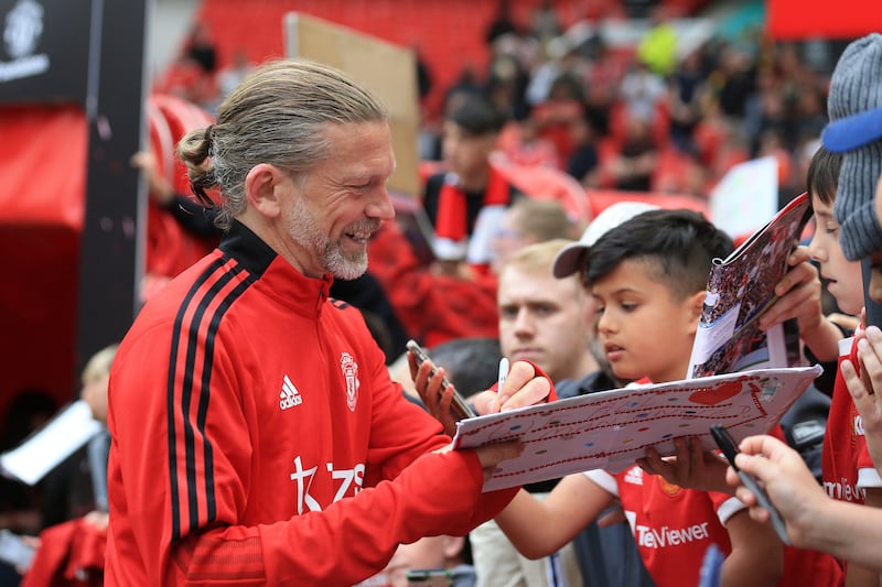 Manchester United's Jesper Blomqvist signs autographs. AFP