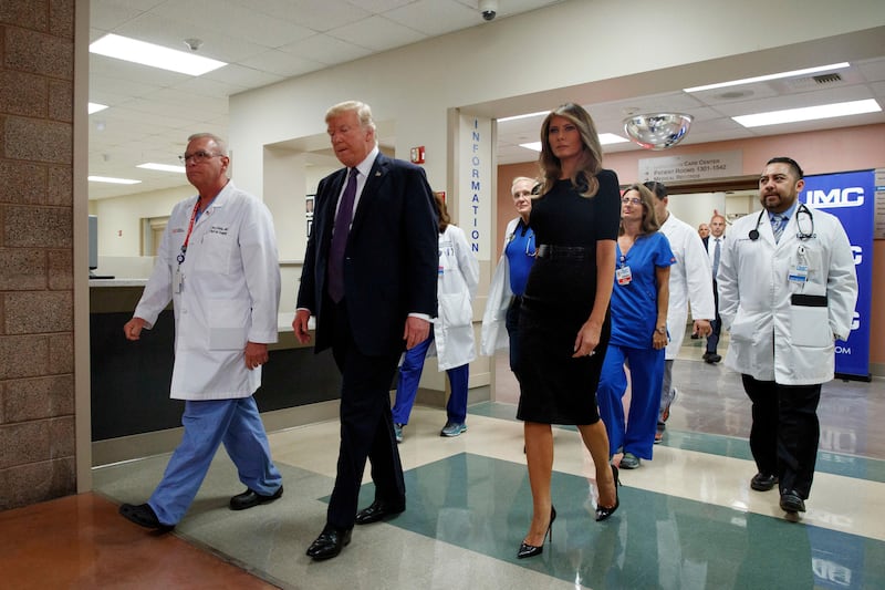 President Donald Trump and first lady Melania Trump walk with surgeon Dr John Fildes, left, at the University Medical Center after meeting with survivors of the mass shooting in Las Vegas. Evan Vucci / AP Photo