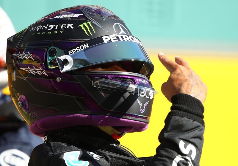 Mercedes' Lewis Hamilton celebrates qualifying in pole position for the Tuscan Grand Prix on Saturday. Reuters