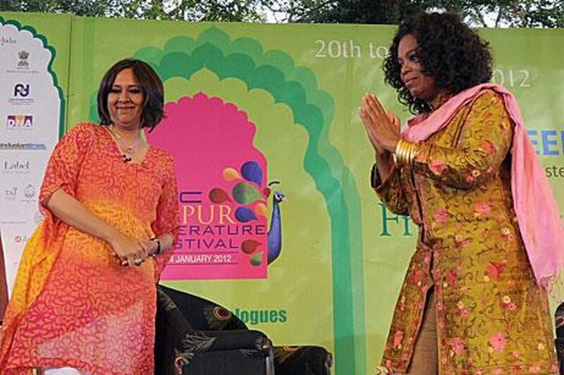 Oprah Winfrey, right, greets the crowd at the Jaipur Literature Festival in India.