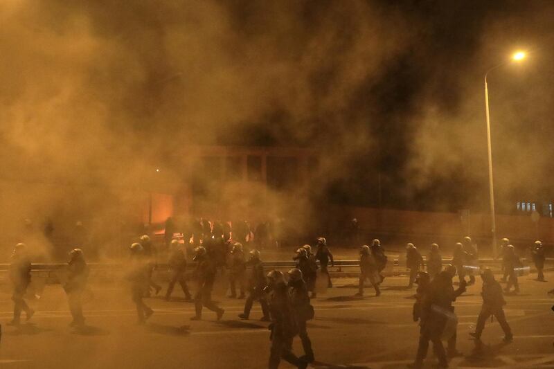 Riot police advance amid tear gas smoke during violent clashes on Wednesday. Reuters