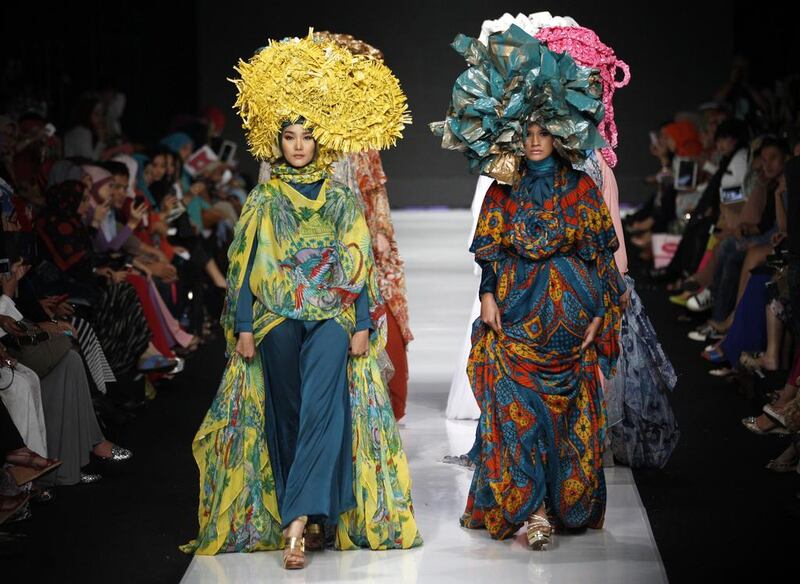 Models display creations by Indonesian designer Feny Mustafa during the Jakarta Fashion Week in Jakarta, Indonesia. Achmad Ibrahim / AP Photo