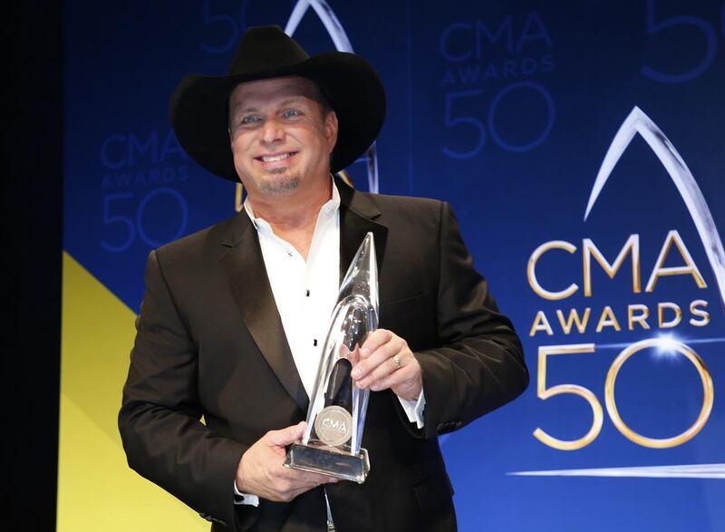 Musician Garth Brooks poses backstage with his award for Entertainer of the Year during the 50th Annual Country Music Association Awards in Nashville, Tennessee, U.S. on November 2, 2016. REUTERS/Jamie Gilliam/File Photo