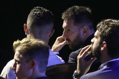 Argentine forward Lionel Messi (R) speaks with Portuguese forward Cristiano Ronaldo (L) during the UEFA Champions League football group stage draw ceremony in Monaco on August 29, 2019. / AFP / Valery HACHE
