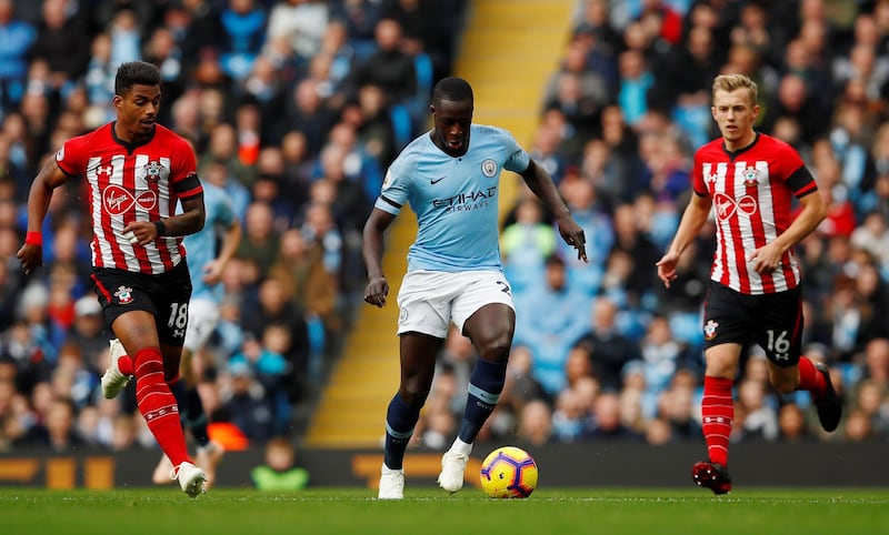 Soccer Football - Premier League - Manchester City v Southampton - Etihad Stadium, Manchester, Britain - November 4, 2018  Manchester City's Benjamin Mendy in action with Southampton's James Ward-Prowse and Mario Lemina   Action Images via Reuters/Jason Cairnduff  EDITORIAL USE ONLY. No use with unauthorized audio, video, data, fixture lists, club/league logos or "live" services. Online in-match use limited to 75 images, no video emulation. No use in betting, games or single club/league/player publications.  Please contact your account representative for further details.