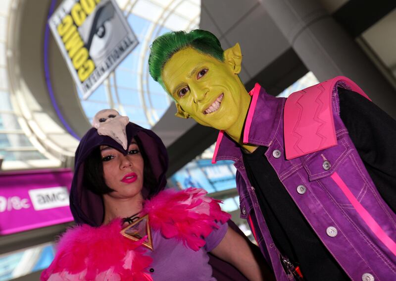 Attendees pose for a picture as they arrive at Comic Con International. Mike Blake / Reuters
