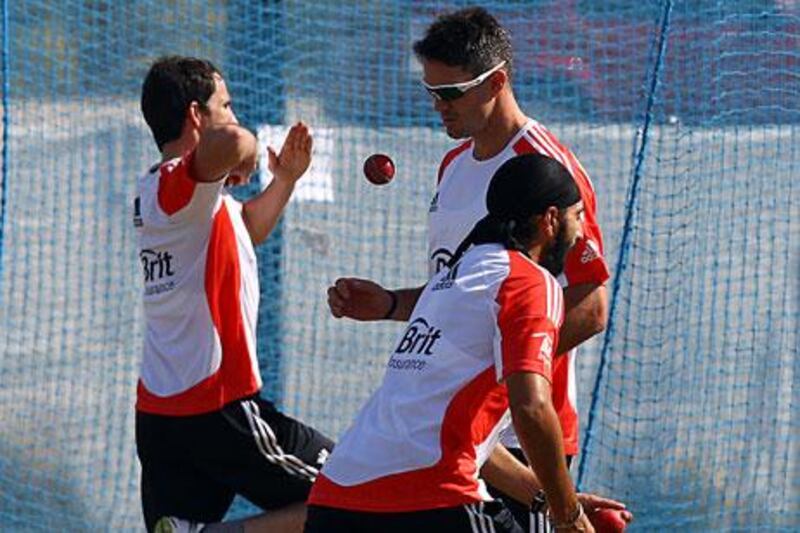 Chris Tremlett, left, Kevin Pieterson and Monty Panesar, front, get some bowling practice in.