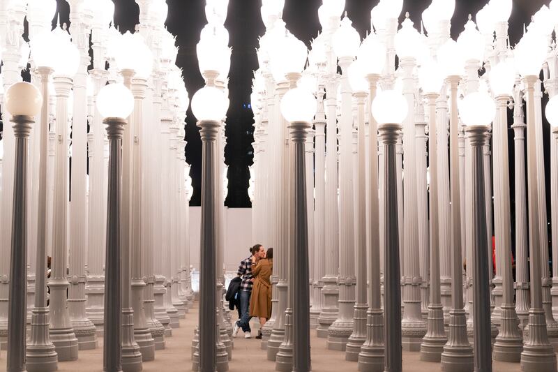 A couple kisses while visiting Chris Burden’s installation ‘Urban Light’ at Los Angeles County Museum of Art, California. AP