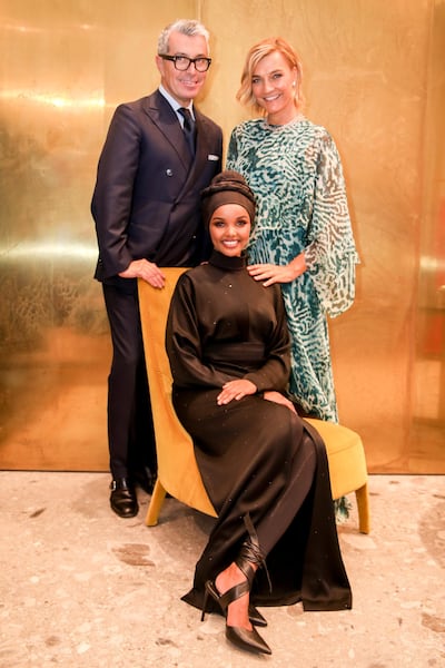 Halima Aden with Giorgio Guidotti and Nicola Maramotti at the Max Mara store in Dubai
