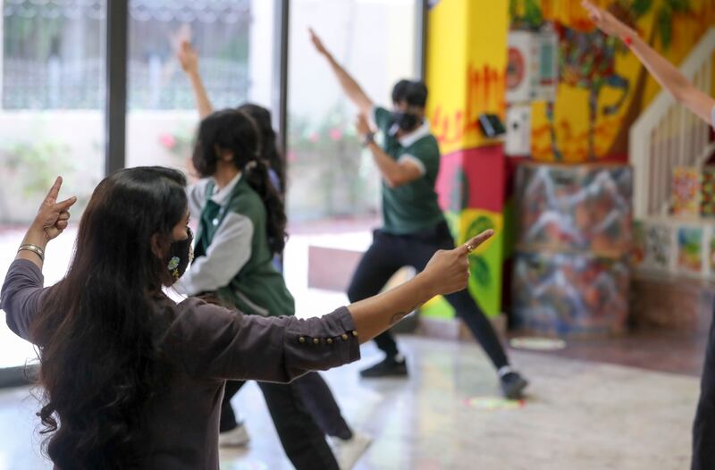 Cultural co-ordinator Prabha Nambiar instructs pupils at Delhi Private School, Jebel Ali, Dubai, during rehearsals for their dance performance for Expo 2020 Dubai. Khushnum Bhandari / The National