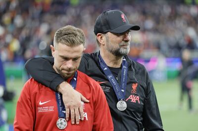 Liverpool manager Jurgen Klopp with captain Jordan Henderson after losing the Champions League final. EPA