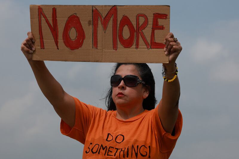 A woman protests against gun violence outside of the Cottonwood Creek Church in Allen, Texas. AFP