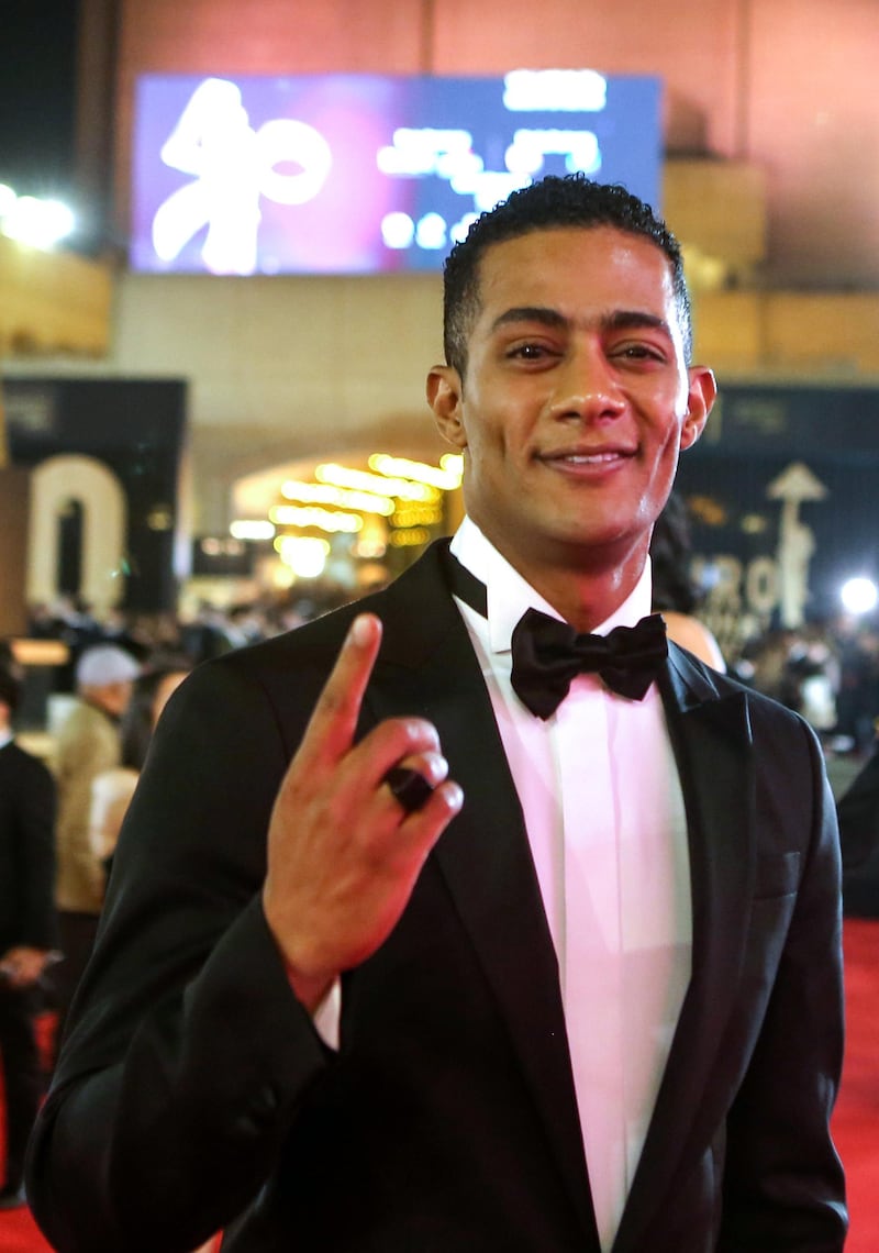 Egyptian actor Mohamed Ramadan poses on the red carpet of the 40th edition of the Cairo International Film Festival (CIFF) at the Cairo Opera House in the Egyptian capital on November 20, 2018. (Photo by Patrick BAZ / Cairo International Film Festival / AFP) / RESTRICTED TO EDITORIAL USE - MANDATORY CREDIT "AFP PHOTO / CAIRO INTERNATIONAL FILM FESTIVAL" - NO MARKETING - NO ADVERTISING CAMPAIGNS - DISTRIBUTED AS A SERVICE TO CLIENTS