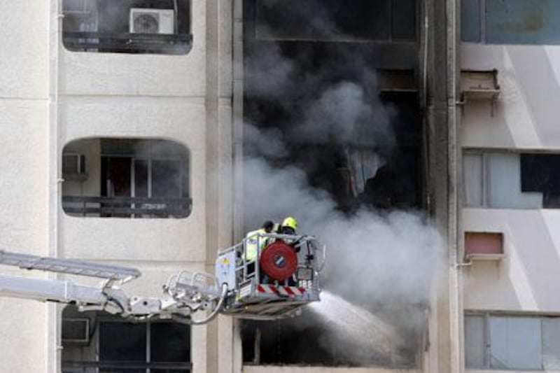 April 4, 2012 (Abu Dhabi) Fire fighters try to put out a apartment blaze on the corner of Muroor and 9th Streets in Abu Dhabi April 4, 2013. (Sammy Dallal / The National)