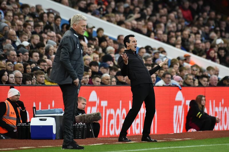 Aston Villa's head coach Unai Emery, right, reacts next to West Ham's manager David Moyes. AP 