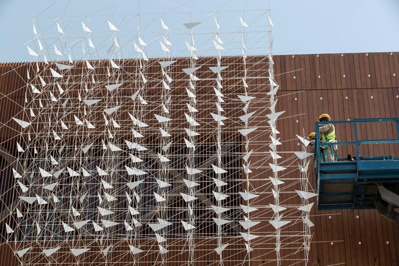 The Polish pavilion at the EXPO 2021 site nears completion. The pavilion has metal birds on the outside and inside that are partially installed along with a special wood panelled interior and exterior on May 2nd, 2021. 
Antonie Robertson / The National.
Reporter: Ramola Talwar for National