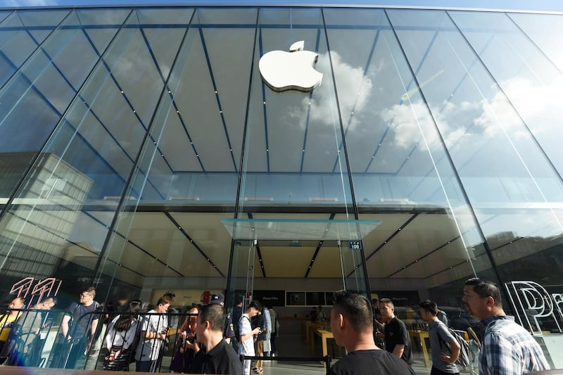 People queue outside an Apple store as the new iPhone 11, iPhone 11 Pro and iPhone 11 Pro Max go on sale, in Hangzhou, Zhejiang province, China. Reuters