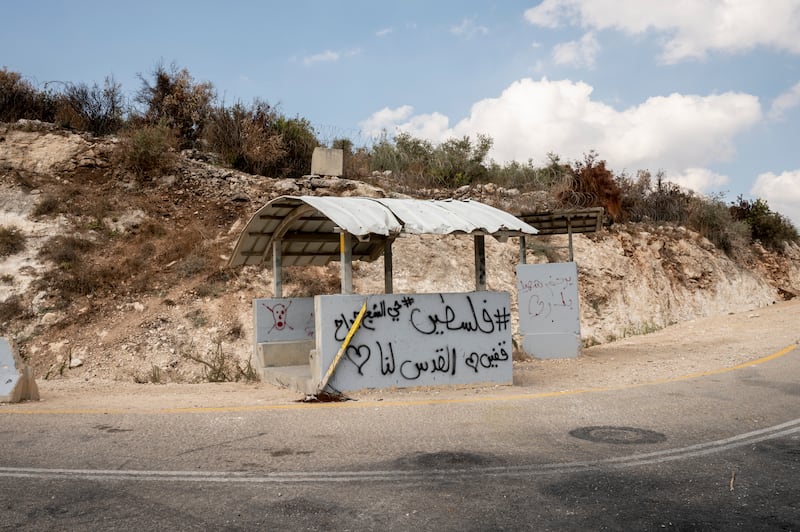 Palestinian graffiti on a stand used by Israeli soldiers in the seam zone in Qaffin. It reads in Arabic: 'Palestine, Sheikh Jarrah, Jerusalem is ours'. Tanya Habjouqa / Noor for The National