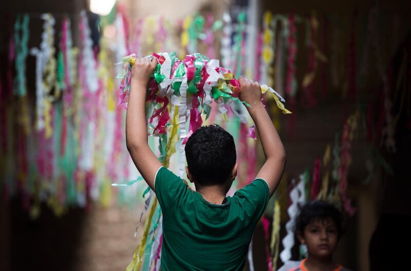 People put up decorations and ornaments in the local tradition in Egypt as part of the celebration of the Holy month of Ramadan, which is expected to start in Egypt on 24 April 2020.  EPA