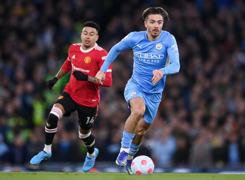 Jack Grealish of Manchester City runs with the ball whilst under pressure from Jesse Lingard. Getty Images