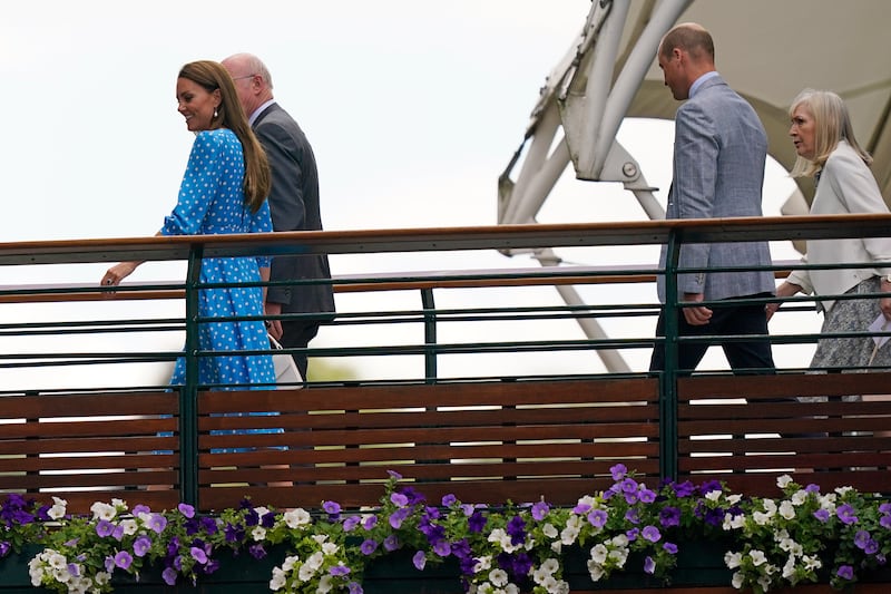 Kate, Duchess of Cambridge and Prince William walk to Centre Court ahead of the quarterfinal match between Novak Djokovic and Jannik Sinner. AP