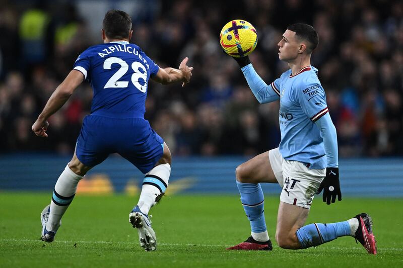 Manchester City's Phil Foden grabs the ball after being fouled by Chelsea's Cesar Azpilicueta. AFP  