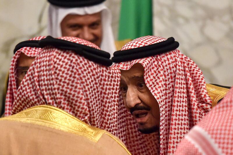 Saudi King Salman bin Abdulaziz chats with King Hamad bin Isa Al-Khalifa of Bahrain. AFP / Fayez Nureldine