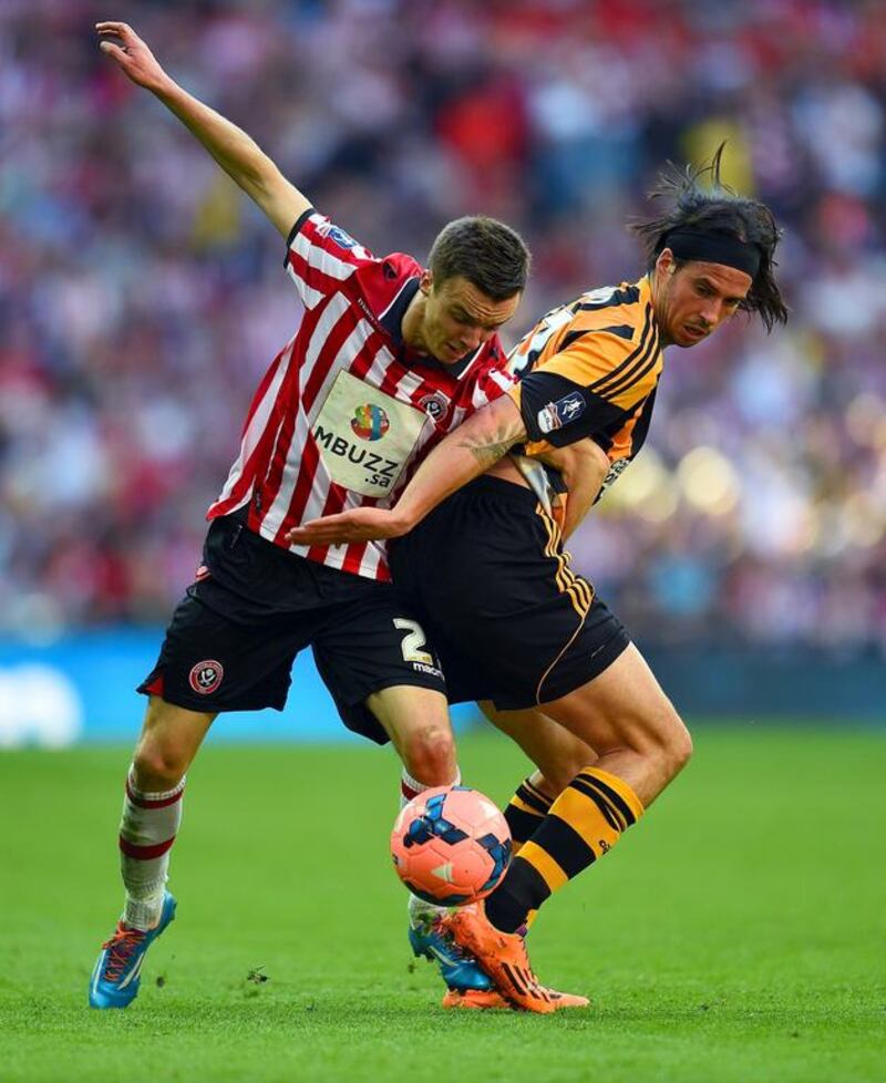 Stefan Scougall, left, of Sheffield United battles with George Boyd of Hull City during their FA Cup semi-final match at Wembley Stadium on April 13, 2014, in London. Shaun Botterill / Getty Images