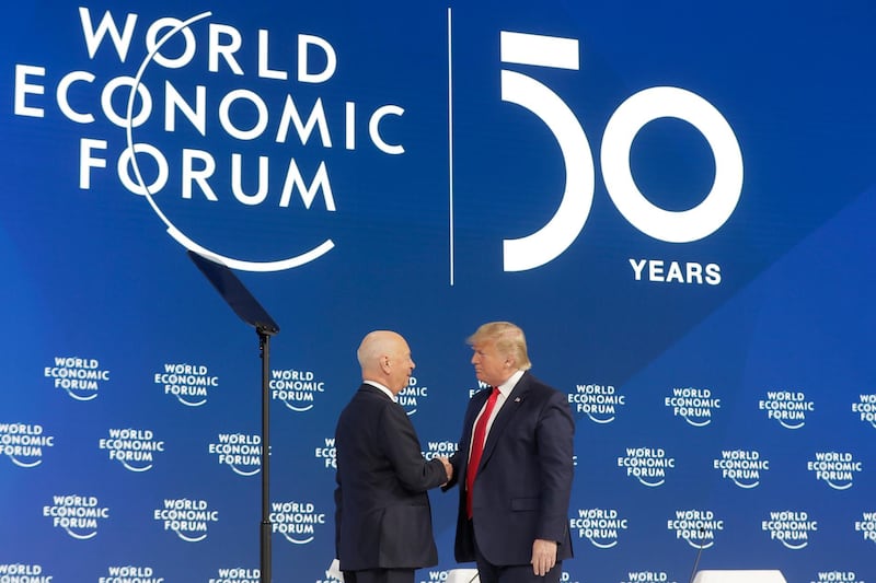 US President Donald Trump is greeted by Executive Chairman Klaus Schwab at the World Economic Forum in Davos. AP Photo