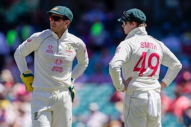 Australian captain Tim Paine, left, said that Steve Smith did not deliberately scuff up the crease during the final day of the third Test against India. AP