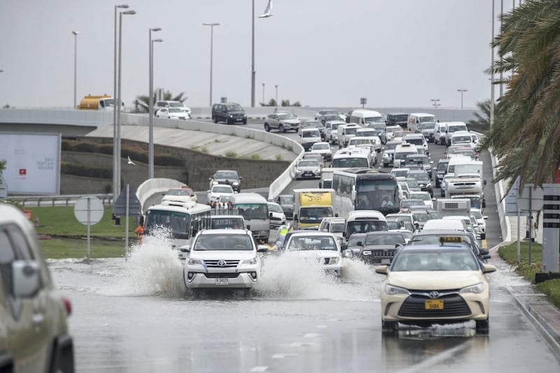 DUBAI, UNITED ARAB EMIRATES. 11 JANUARY 2020. Heavy rains in Dubai during the night caused extensive flooding at intersections within the city. Commuters and pedestrians battle high waters to get to their destinations. Traffic caused by flooding and diversions on the Umm Suqeim Str and Sheikh Zayed rad intersection heading down towards the Dubai Police Academy traffic light. (Photo: Antonie Robertson/The National) Journalist: Standalone. Section: National.

