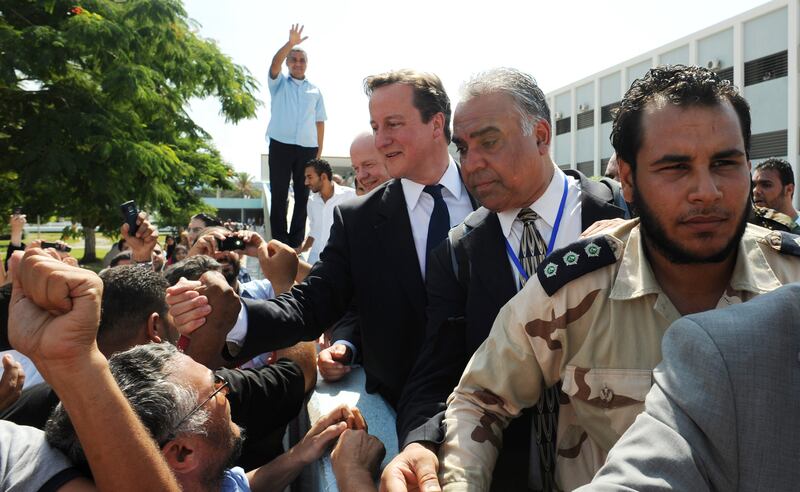 Mr Cameron is greeted by wellwishers during a visit to Tripoli in September 2011. Getty Images