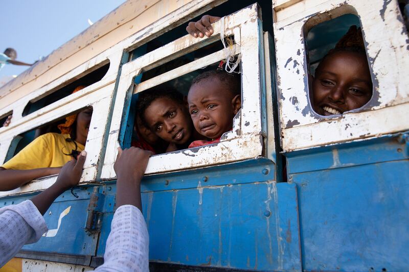 Refugees who have fled the Tigray region of Ethiopia, in a bus taking them to the Village 8 temporary shelter, near the border between Ethiopia and Sudan.