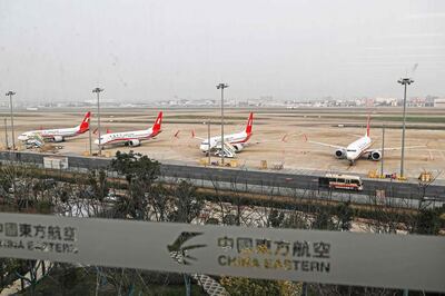 This photo taken on March 11, 2019 shows three Boeing 737 MAX 8 planes from Shanghai Airlines parked at Shanghai Hongqiao International Airport in Shanghai. China on March 11, 2019 ordered domestic airlines to suspend commercial operation of the Boeing 737 MAX 8, citing the Ethiopian Airlines crash and another deadly accident of that same model in Indonesia. - China OUT
 / AFP / STR
