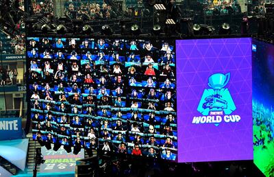 Players are seen on screen during the final of the Solo competition at the 2019 Fortnite World Cup July 28, 2019 inside of Arthur Ashe Stadium, in New York City.  / AFP / Johannes EISELE
