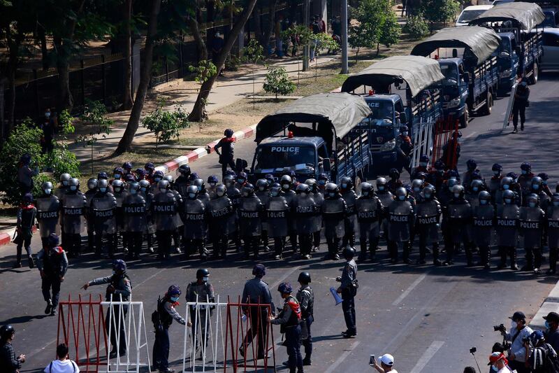 Riot police stand guard on a road during a demonstration against the military coup in in Yangon. AFP