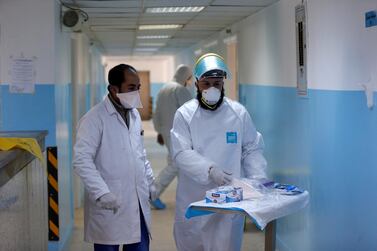 Doctors in Amman, Jordan walk through a special ward for patients suspected to have coronavirus. Muhammad Hamed / Reuters