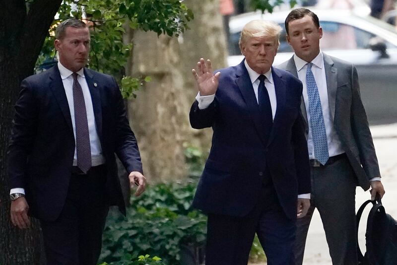 Former president Donald Trump waves as he arrives for the funeral for his first wife, Ivana Trump, on July 20 in New York. AP